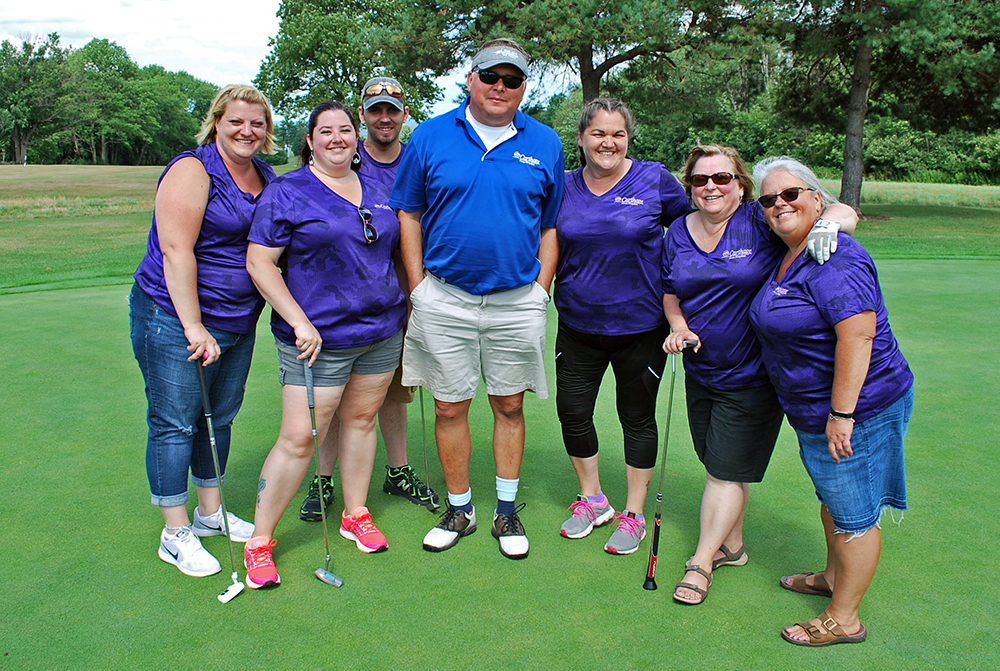 Group of golfers posed for photo on course